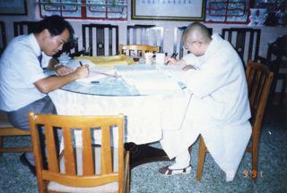 Ven. Wang Fun was signing a contract with the contractor, Gammon Construction Limited, in 1991